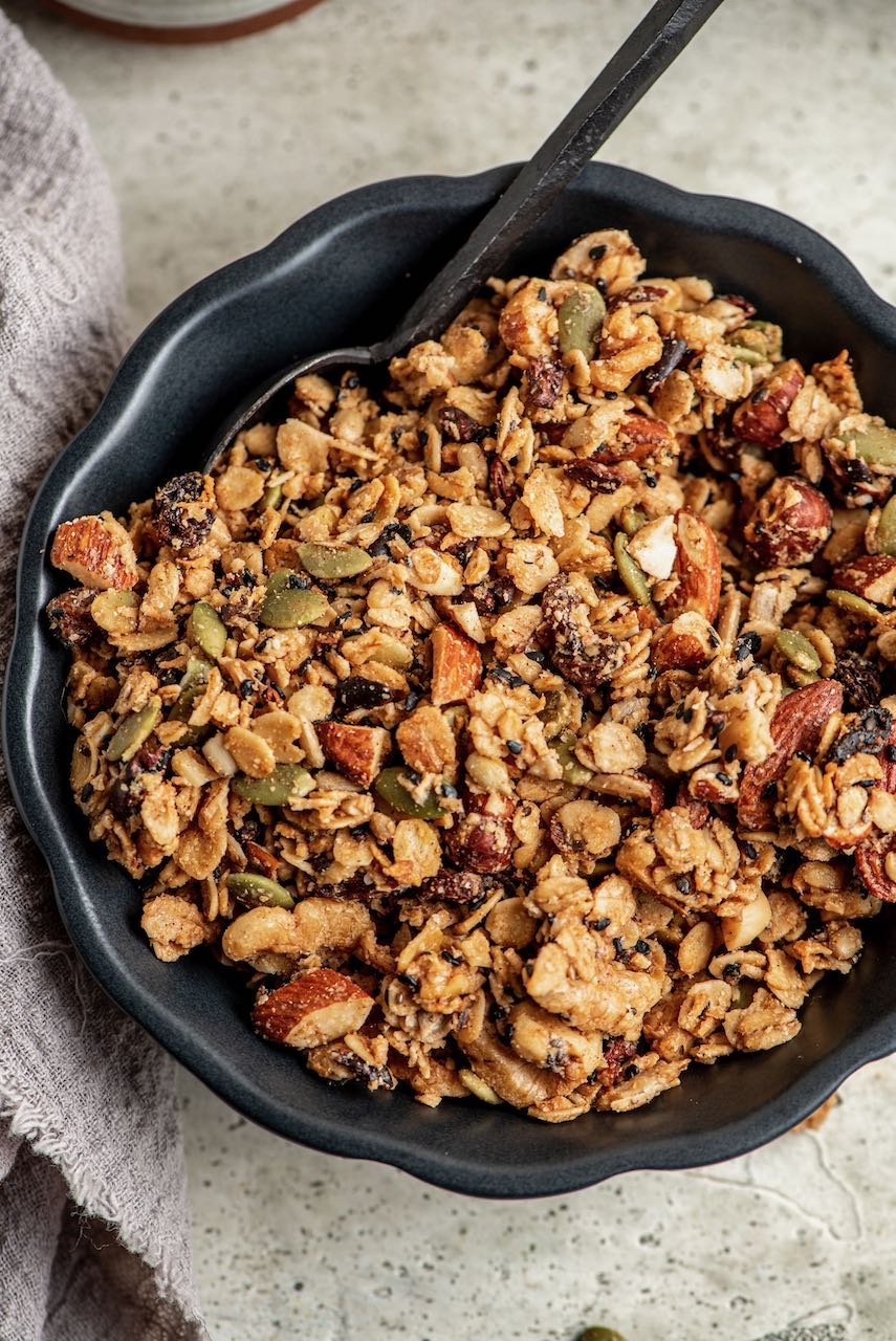 a black bowl filled with granola