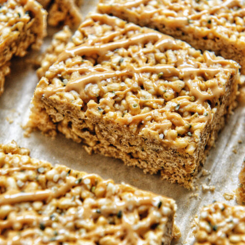 close up of healthy freshly crispy treat with peanut butter on top and hemp seeds by teri-ann carty