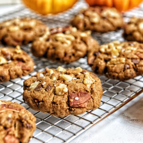 side view of a freshly baked pumpkin walnuts chocolate chip cookies by teri-ann carty