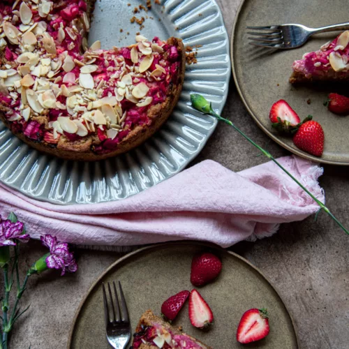 strawberry rhubarb cake on a blue dish