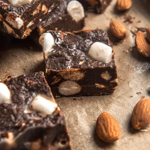 parchment paper with rocky road fudge, almonds and marshmallows