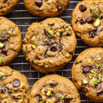 Freshly baked chocolate chip and pistachio gluten free cookies with sea salt flakes by teri-ann carty