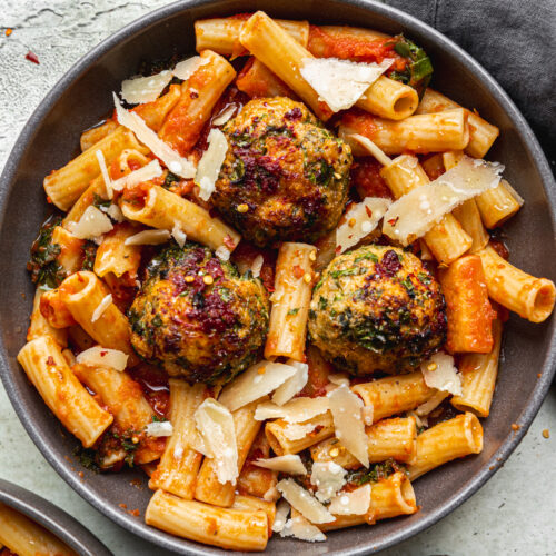 bowl of pasta with meatballs, includes shredded parmesan cheese by teri-ann carty