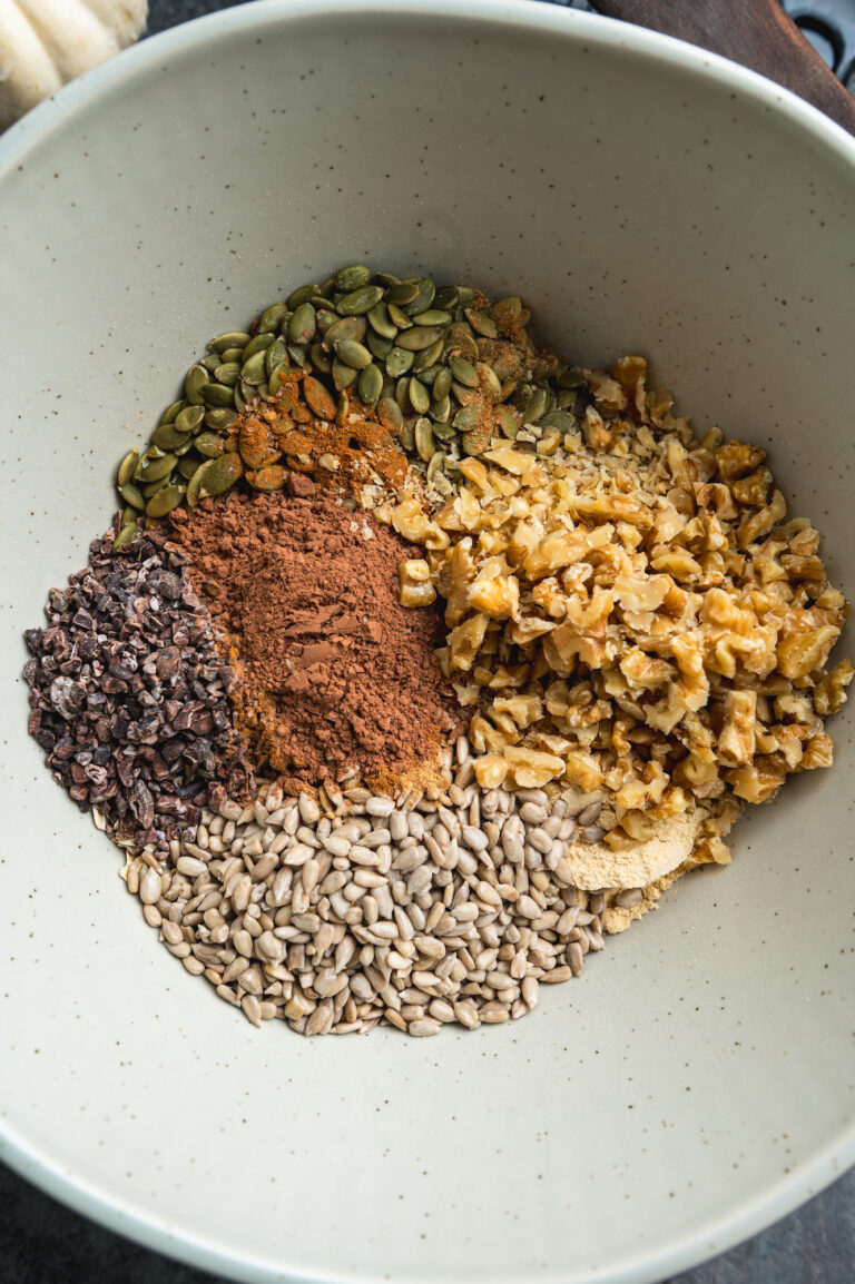 overhead view of bowl with mix of ingredients for chocolate granola by teri-ann carty