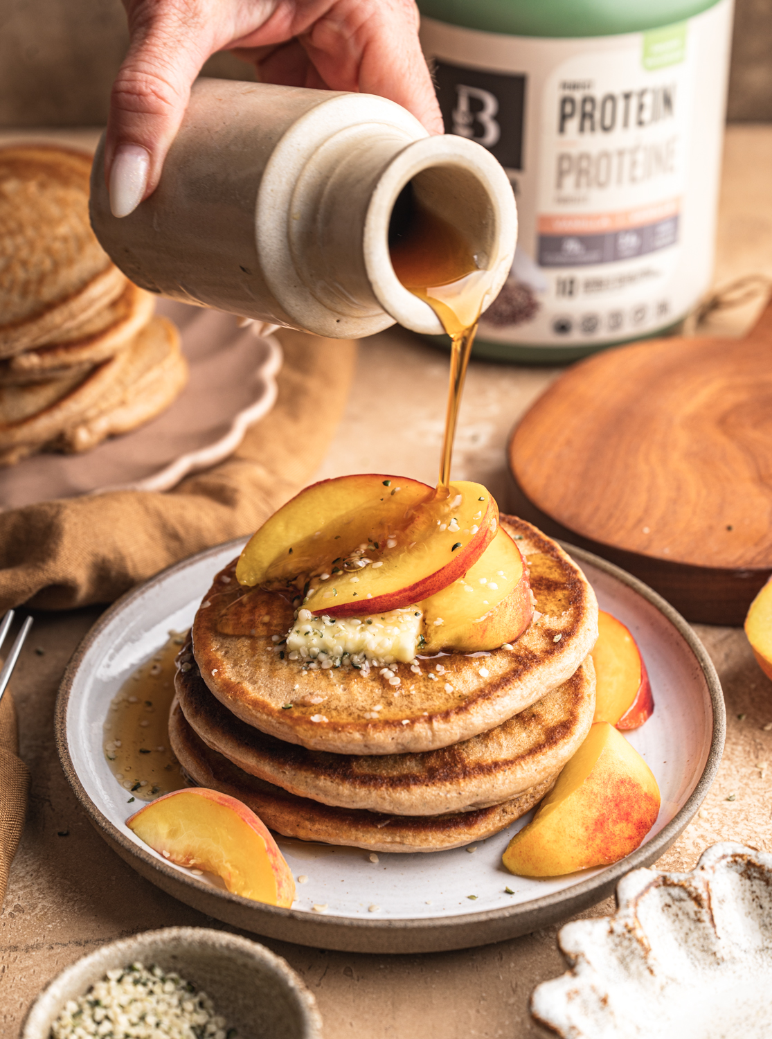 Protein pancake stacks from the freezer golden fluffy with protein powder topped with Greek yogurt and berries