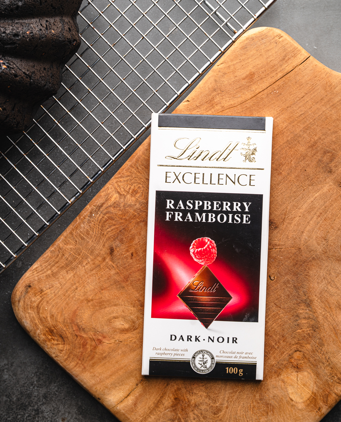 raspberry dark chocolate package on a wooden cutting board