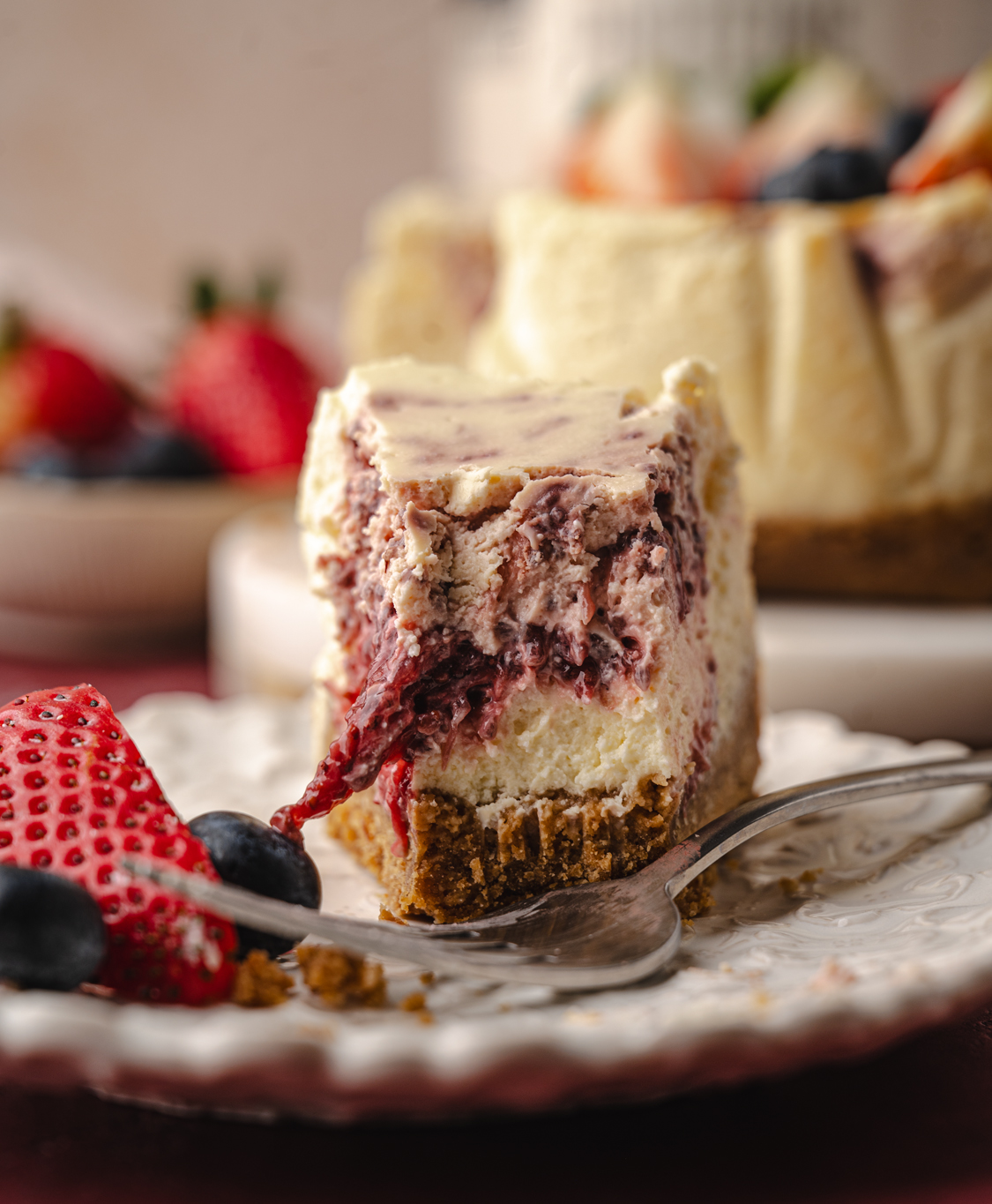 close up of slice of a high-protein strawberry cheesecake