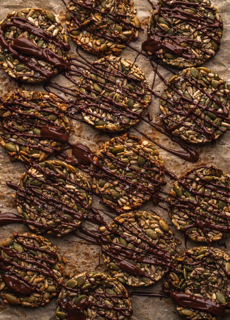 tray of freshly baked cookies with chocolate drizzle