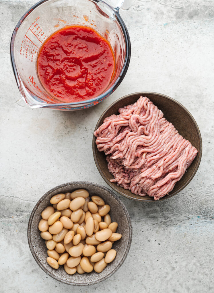 ingredients to make tomato chicken which will go into stuffed sweet potatoes