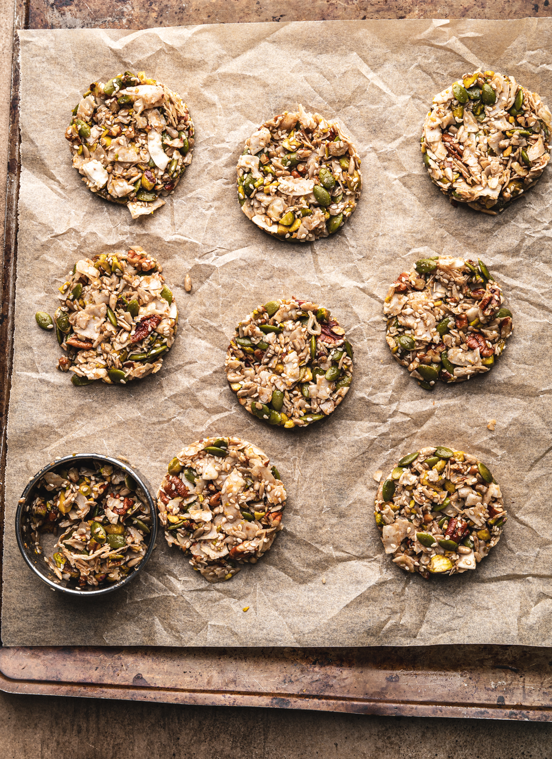 nine prebaked grain free cookies, the tenth cookie is in a cookie shaper