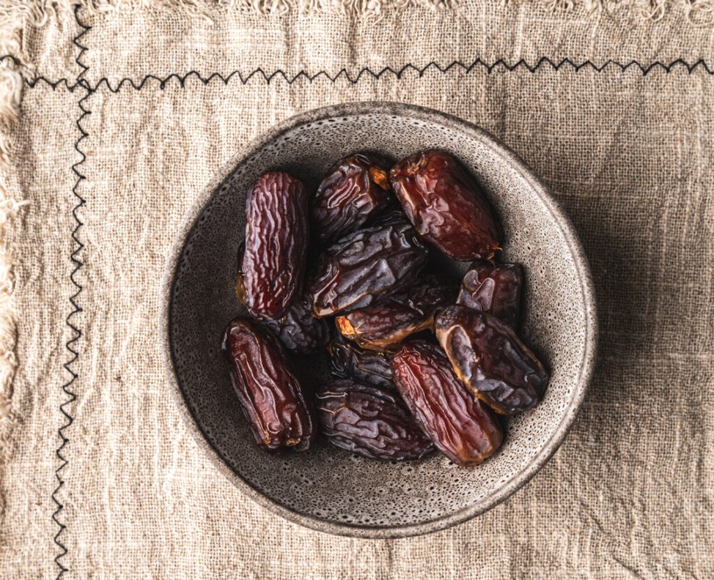 natural ceramic bowl filled with medjool dates