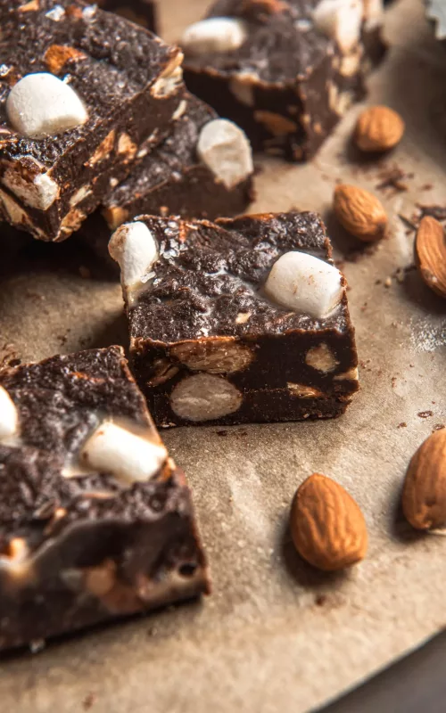 parchment paper with rocky road fudge, almonds and marshmallows